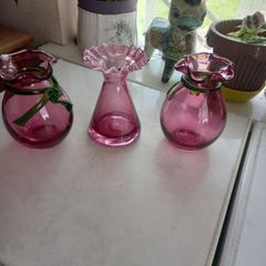 three  red vintage vases