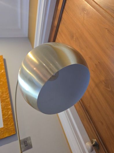 Gold arc free standing lamp