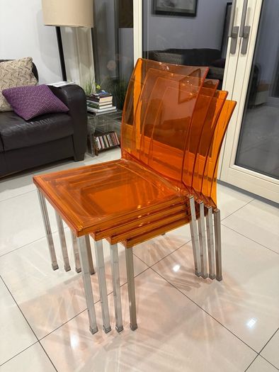 Four striking chrome and plastic orange vintage Italian dining chairs. Very decent and useable condition. A bargain at this price.