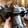 Old heavy Olympus OM101 Camera with lens. Image 3