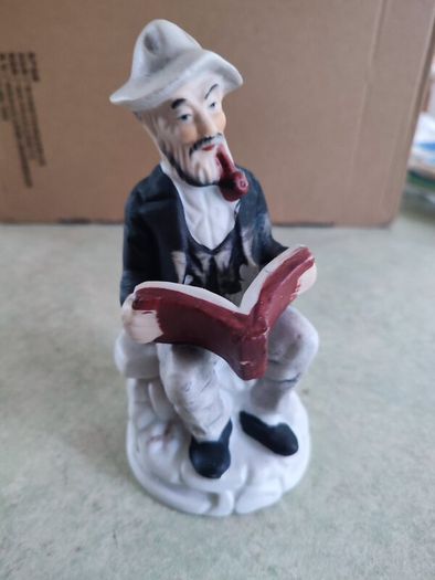 Figurine OF Old Man Sitting On Bench, Smoking His Pipe Reading Book Vintage