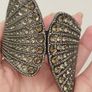A striking wide bracelet encrusted with sparkling rhinestones. Image 5
