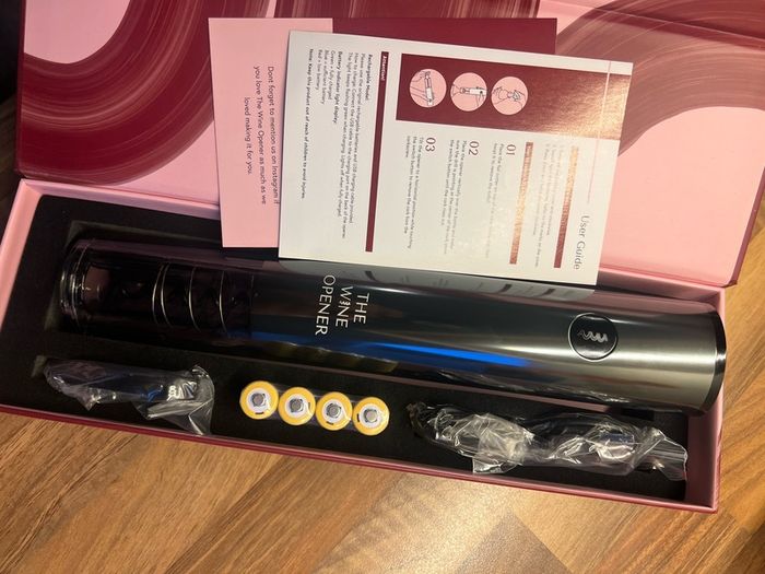 Brand new, never used rechargeable electric wine opener in original packaging.