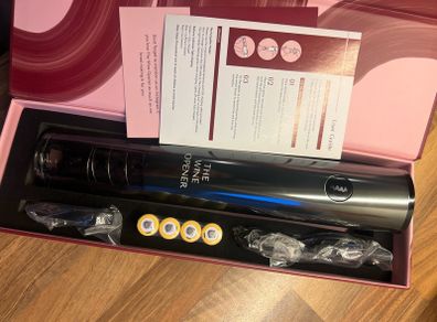 Brand new, never used rechargeable electric wine opener in original packaging.