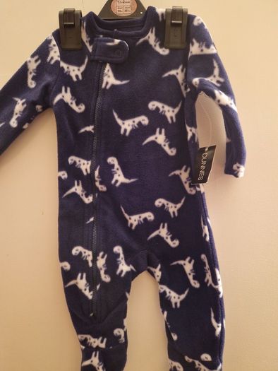A selection of brand new baby clothes and items