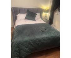 Reduced kingsize bed frame with matching curtains and leather armchair
