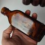 316 - Set of 9 Different Sizes Amber Glass Collectible Decorative Bottles and Jars Image 8