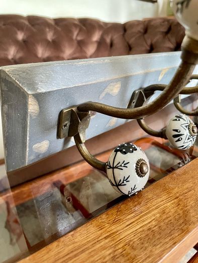 New Unused Stylish Entryway Mounted Ceramic and Brass Coat Hanger