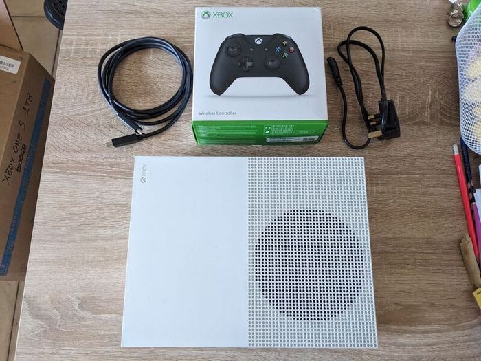 Xbox One S 1TB with controller and cables.