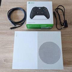 Xbox One S 1TB with controller and cables.