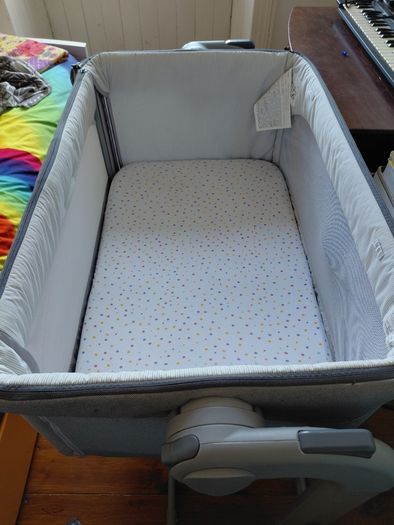 Next to me Chicco magic cot with snuz breatheble matress and bed sheets.