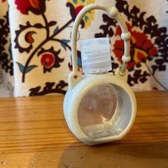 Refillable hand gel- attach it to a bag