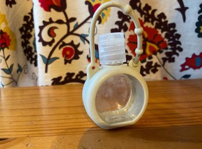 Refillable hand gel- attach it to a bag