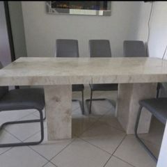 solid marble dining and 6 chairs.