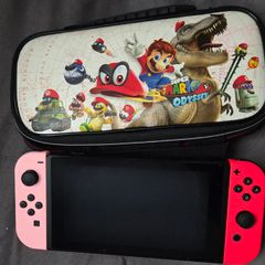 Nintendo Switch with original case and Anker adapter.