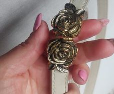 Rose belt never worn Price 18 euro