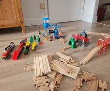 wooden train play set with two electric locomotives and lots of parts