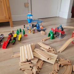 wooden train play set with two electric locomotives and lots of parts