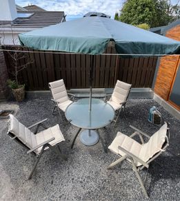Garden Table with 4 recliner arm chairs with cushions & parasol