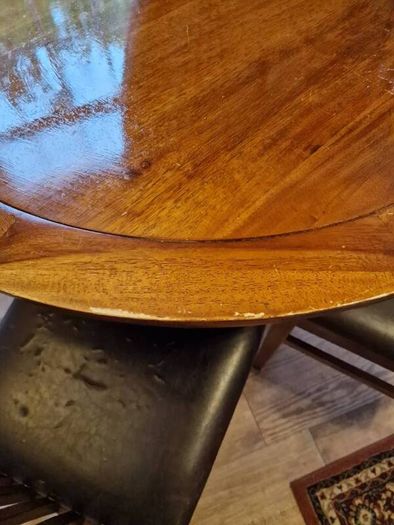 Round wooden table and four chairs