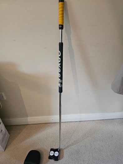 Odyssey broomstick putter.