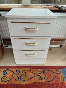 Two white bedside lockers