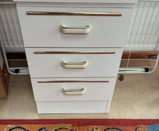 Two white bedside lockers
