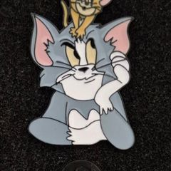 Tom and jerry , pin back badge.