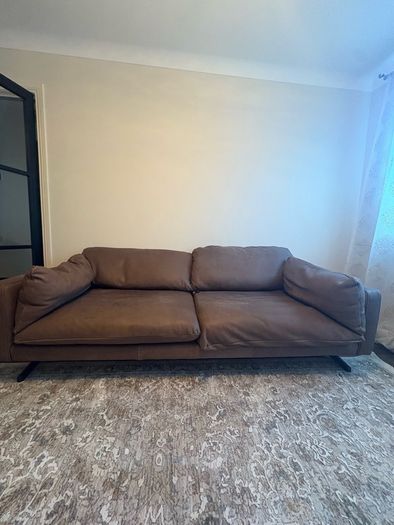 Leather sofa with original harvey Norman tag still attached