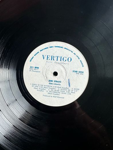 Dire Straits original release of Dire Straits. Vinyl is near mint except for some writing on label