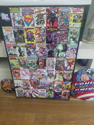 large wooden framed super heroes and villans wall hanging and 2 metal wallhanging discs