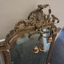 Two distinct antique giltwood mirrors with elaborate French-style ornamentation Image 8