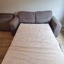 Grey two-seater sofa bed with matching storage footstool Image 8