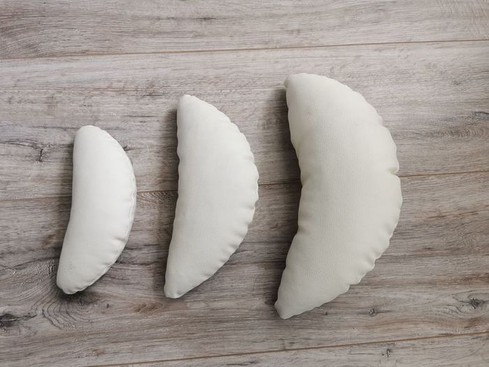 Crescent shaped pillows for newborn photoshoots
