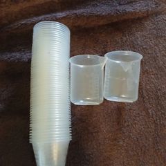 56 measuring cups for medication, brand new