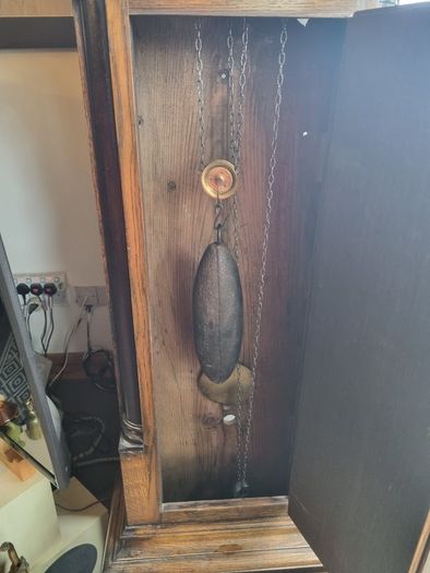 A Georgian grandfather clock made by the English clockmaker John Rogers of Leominster