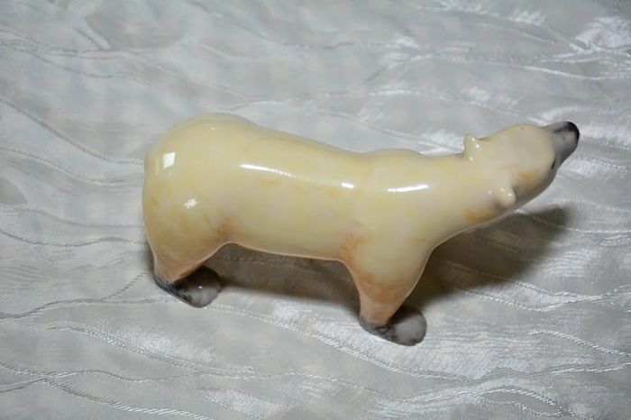 Stone sculpture of a white polar bear