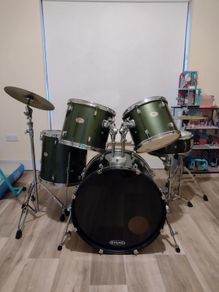 Pearl Drum Kit with professional drum heads.