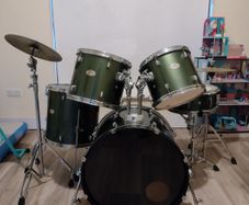 Pearl Drum Kit with professional drum heads.