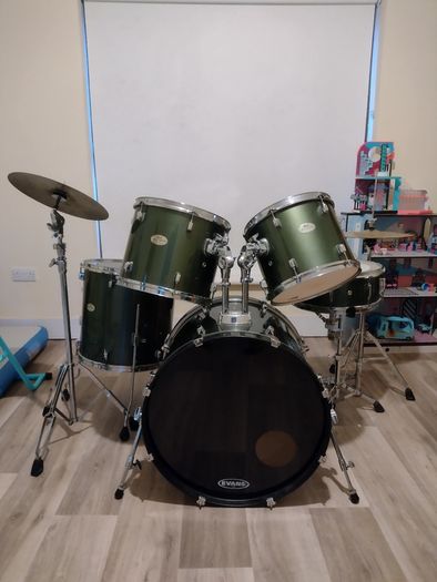 Pearl Drum Kit with professional drum heads.
