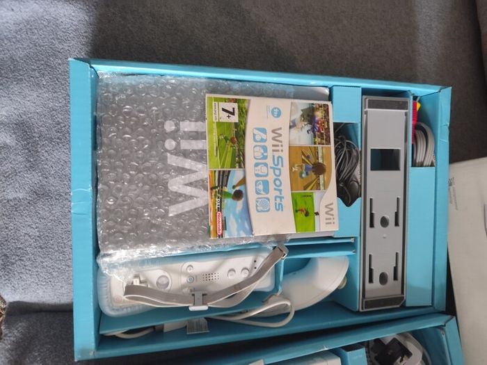 Wii with box, two controllers, sports and HDMI adapter