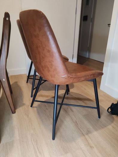 pair of faux leather dining chairs