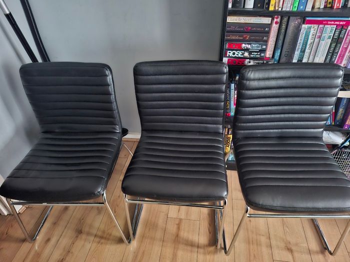 3 faux leather chairs