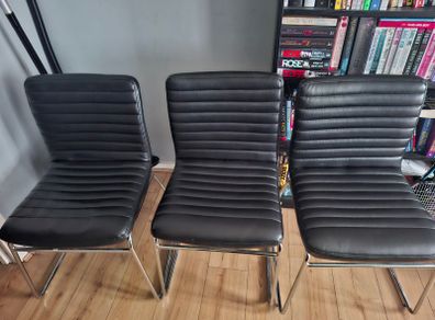 3 faux leather chairs