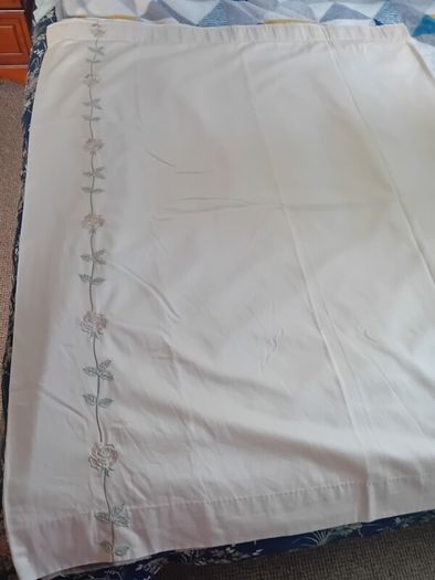 A pair of vintage embroidered curtains