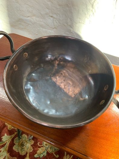 Large heavy antique copper dish with ring handles.