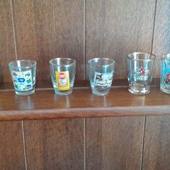 A lot of 6 shot glasses all different
