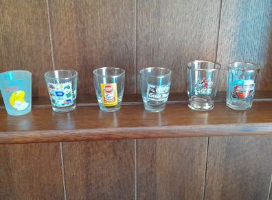 A lot of 6 shot glasses all different
