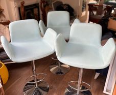 Three aqua blue armchair-style designer barstools by Decoronline