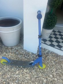 Blue two wheel scooter